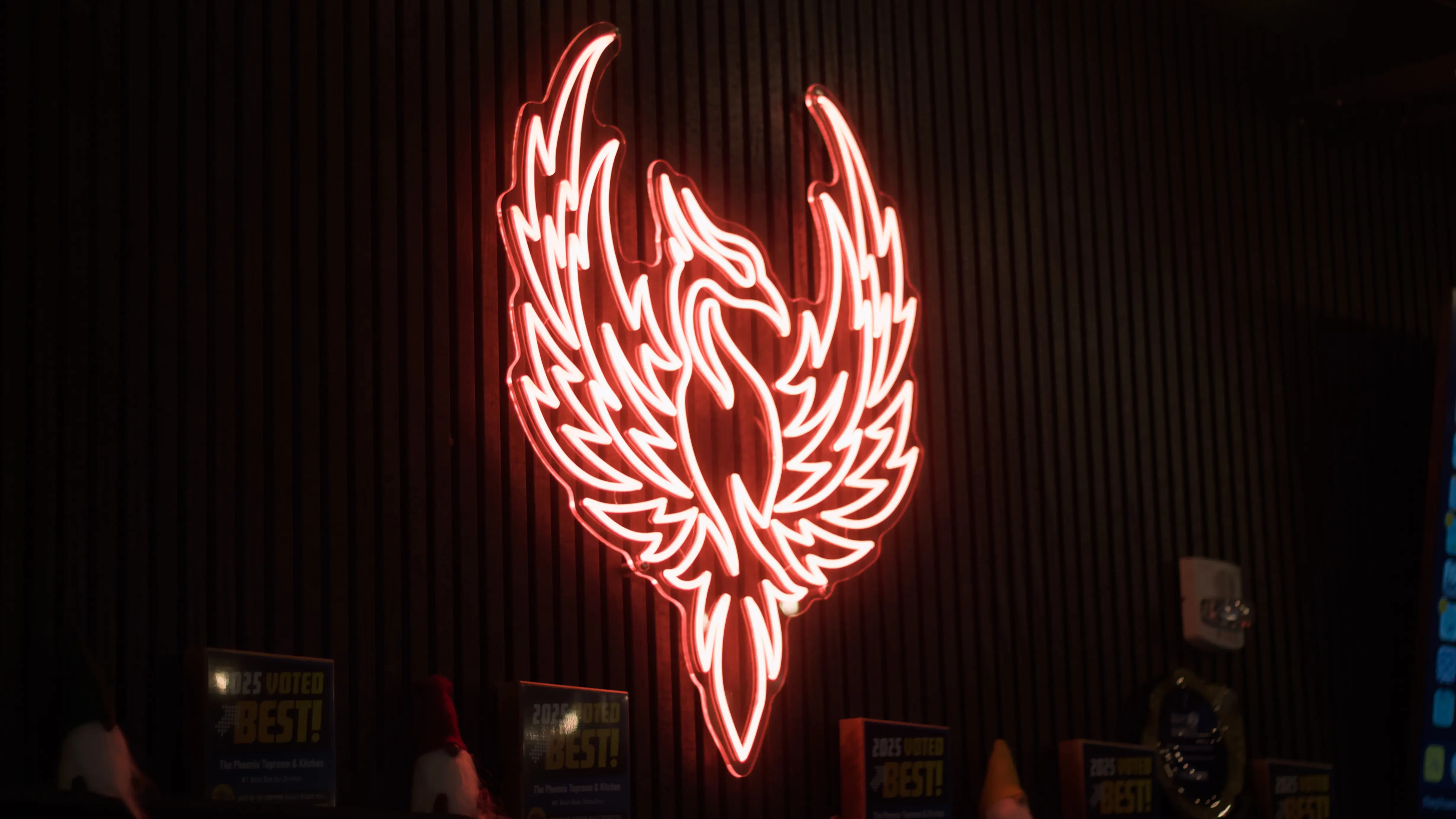 Neon logo of The Phoenix.