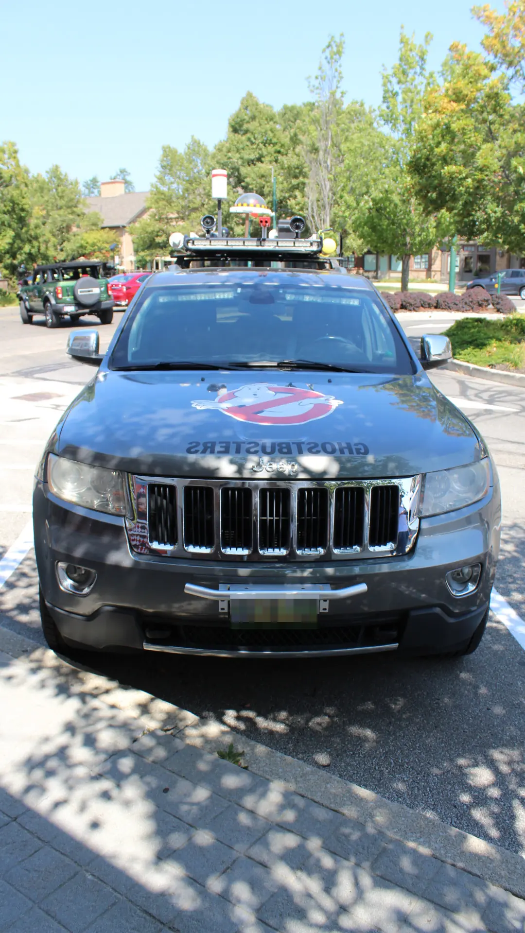 A Jeep Grand Cherokee designed like the Ghostbusters car from the front.